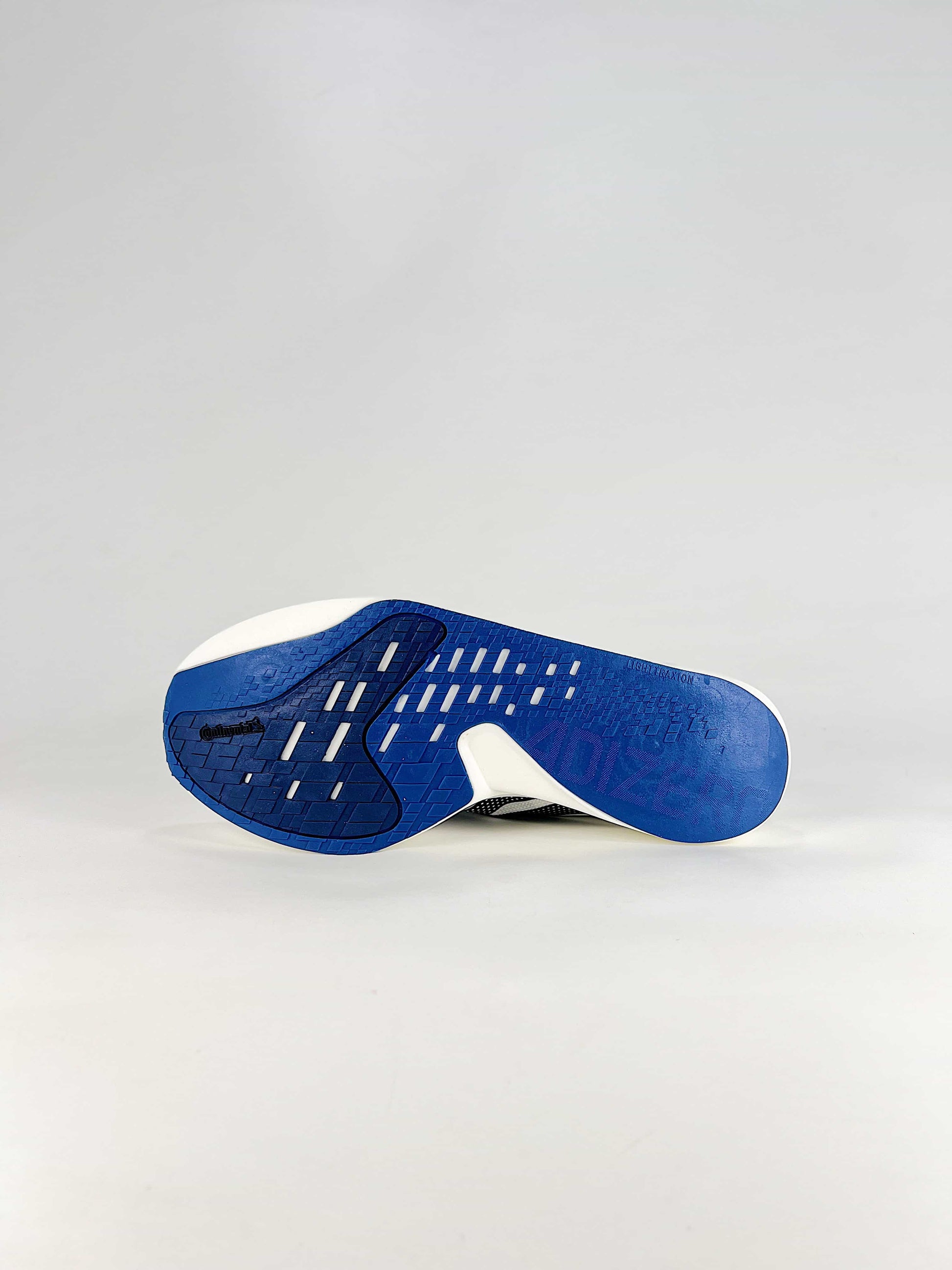Adidas Adizero Adios 10 – Front 3/4 view, White/Navy