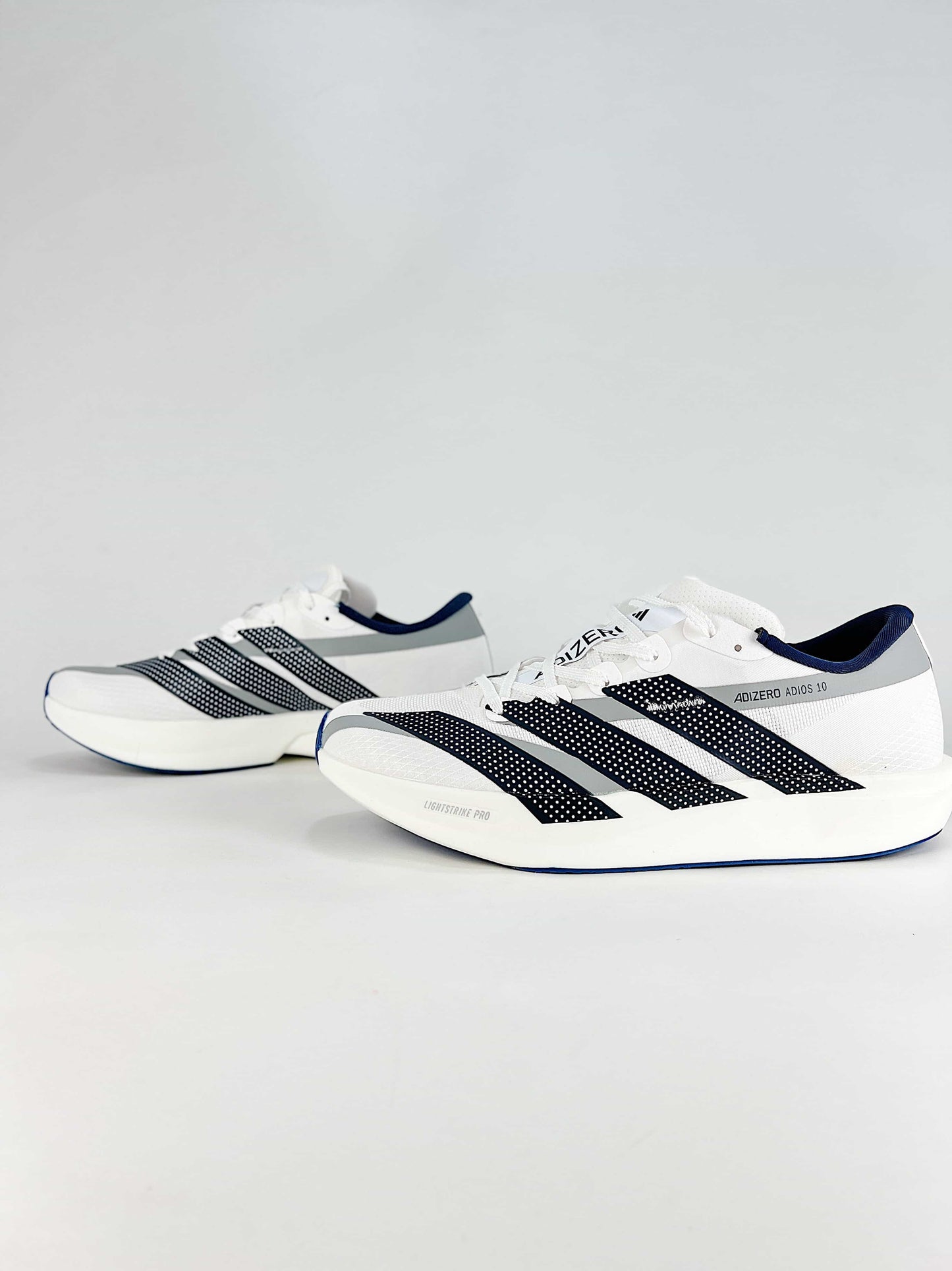 Adidas Adizero Adios 10 – Pair side view